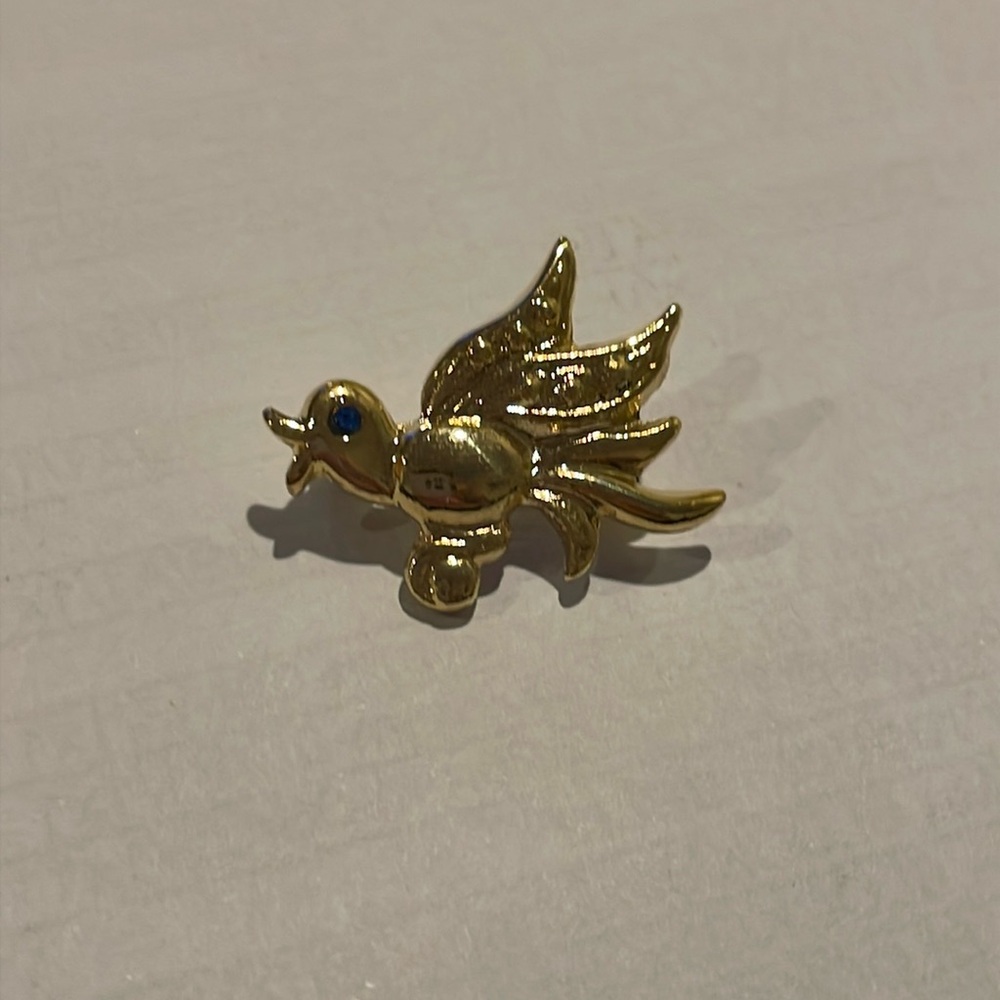 Vintage gold bird brooch with sapphire eye